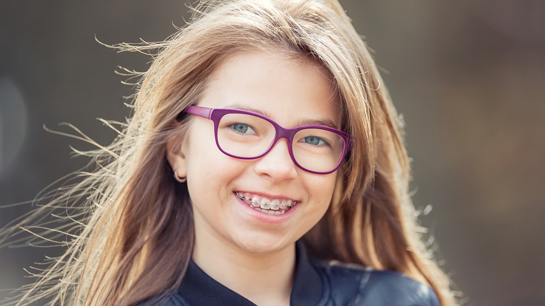 girl with pink glasses