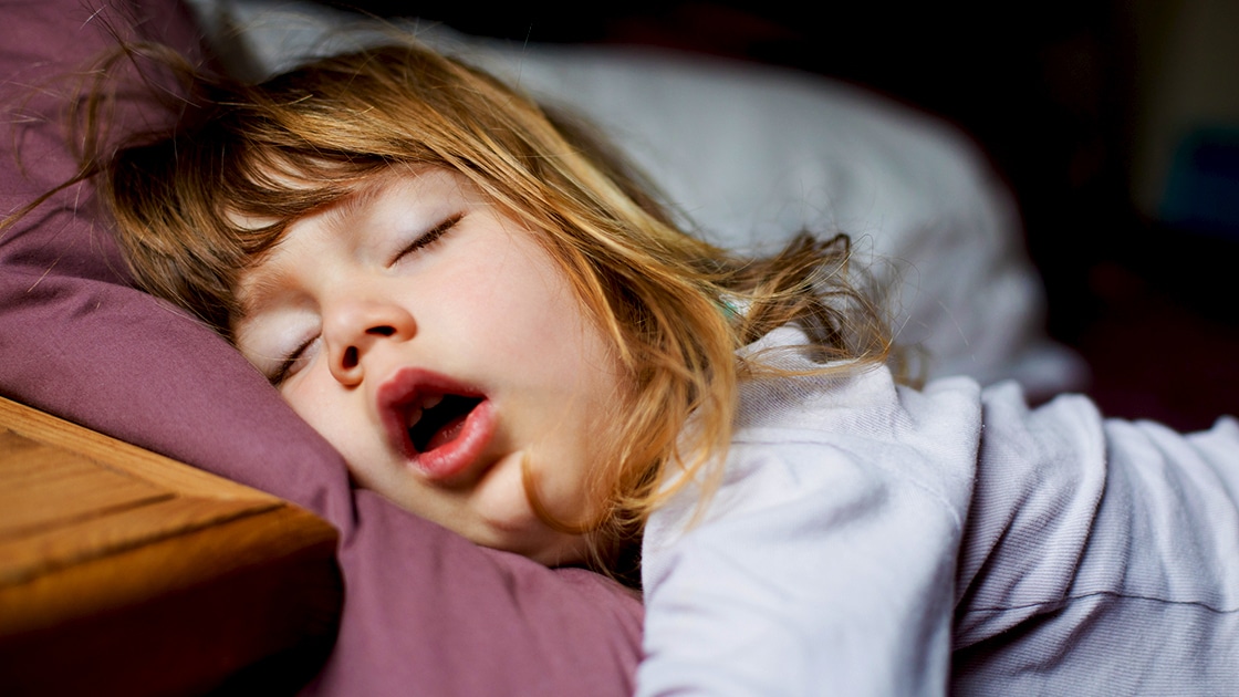 Child sleeping with open mouth